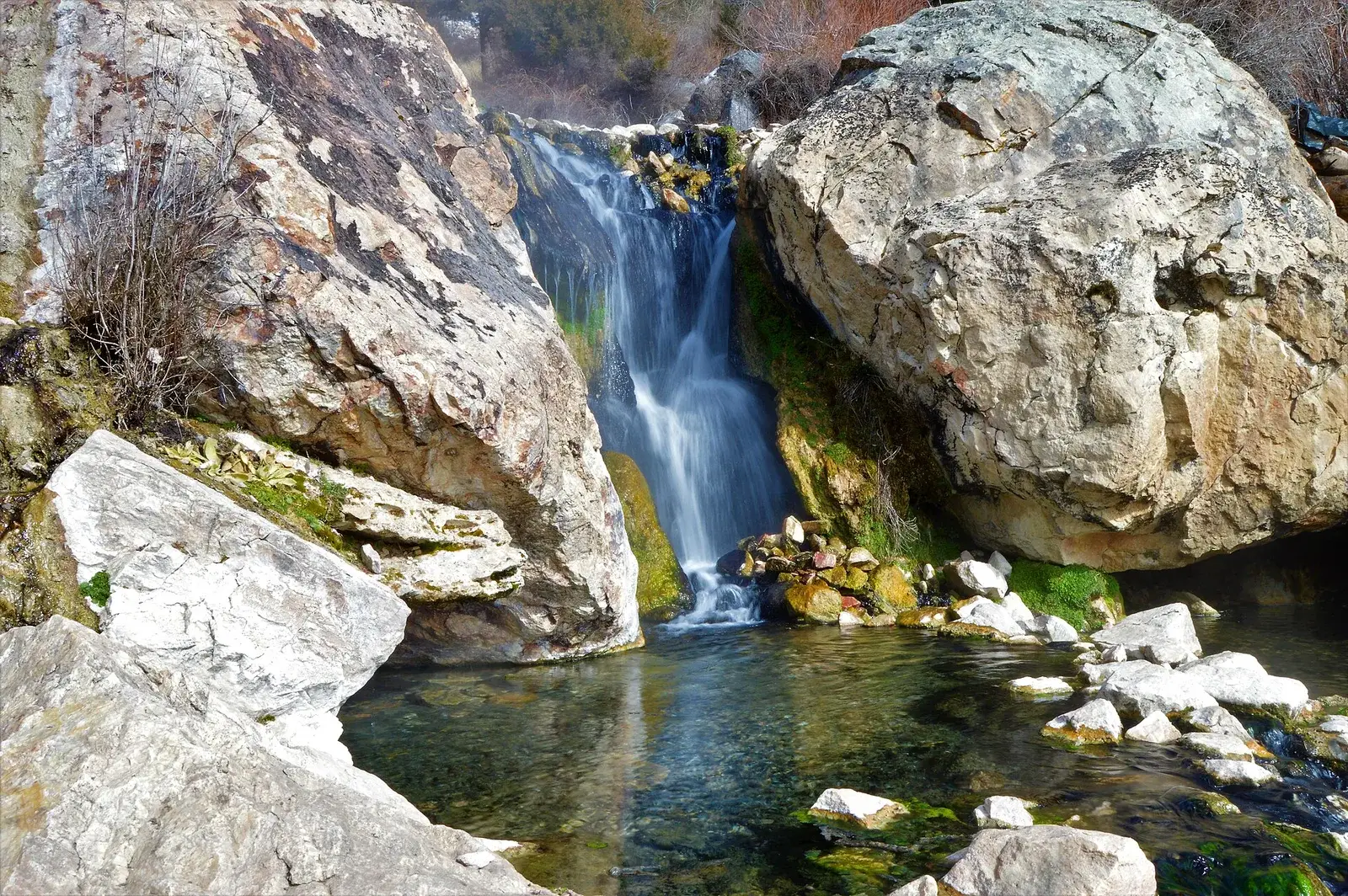 Waterfall pouring into the soaking pool at Goldbug Hot Springs, Idaho